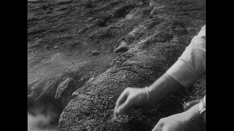 1952 : A man lights a match to create artificial smoke with the help of steam Stock Footage