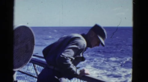 1952: ship on open sea, crew working, man leans over to look over the side SAN Stock Footage