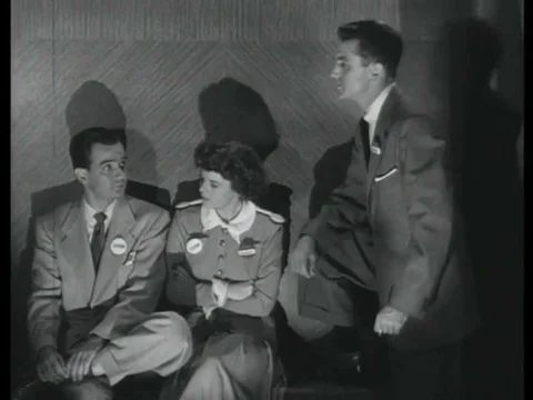 1952, Two men trapped in an elevator during a practice air raid argue opposing Stock Footage 83215221