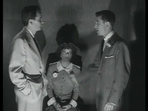 1952, Two men trapped in an elevator during a practice air raid argue about Stock Footage 83215228