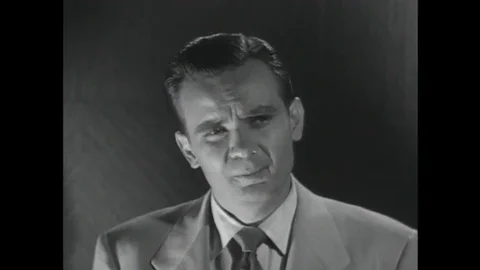 1952 Two men trapped in an elevator during a practice air raid argue opposing Stock Footage 115668149