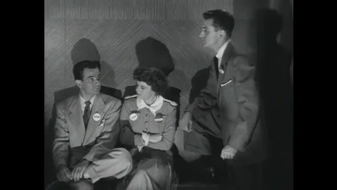 1952 Two men trapped in an elevator during a practice air raid argue opposing Stock Footage 115668258