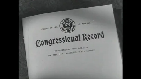 1952 Two men trapped in an elevator during a practice air raid argue opposing Stock Footage 115668374