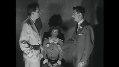 1952 Two men trapped in an elevator during a practice air raid argue about Stock Footage 115668496