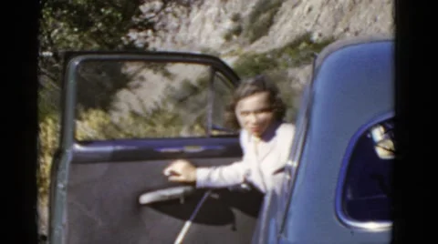 1952: women exits car driving pacific coast highway road. CALIFORNIA Stock Footage