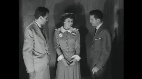 1952Two men trapped in an elevator during a practice air raid argue opposing Stock Footage 115668073
