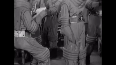 1953 - An astronaut crew which includes a woman dons their gear to go into outer 스톡 동영상 129450815