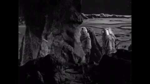 1953 - Astronauts on the moon duck to avoid a meteorite. 스톡 동영상 129450131