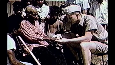 1954 - Marshall islanders are checked for skin legions and other deformations Stock Footage 84789619