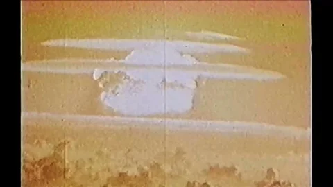 1954 - As a mushroom cloud from an atomic bomb explodes, narration explains how 스톡 동영상 84789564