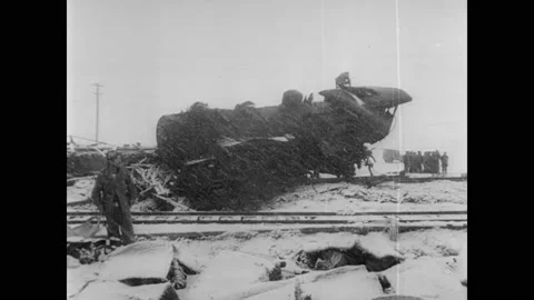 1954 - Rescue workers are hampered by a snowstorm after a horrendous train crash Stock Footage 172585287