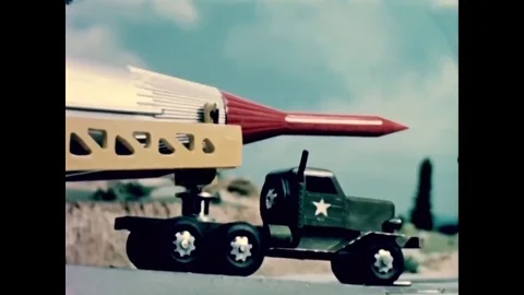 1954 - A scale model shows elevators in a work stand erecting an XB-65 launch 動画素材 83104775