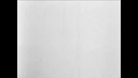 1955 - An atomic bomb blast explodes into a mushroom cloud and the shockwave Stock Footage 85948009