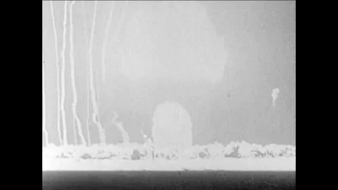 1955 - A nuclear device is detonated and it explodes into a mushroom cloud and 動画素材 85947855