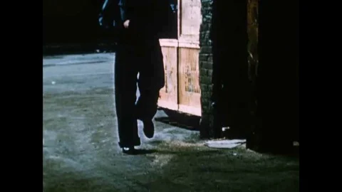 1955 - A saboteur is able to start a fire on a pier, because someone stacked Stock Footage 119015780