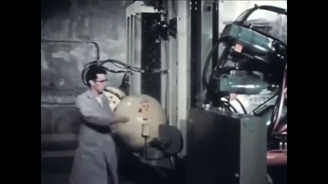 1956 - From a remote room, operators combine the two halves of the Zero Power Stock Footage 94258111