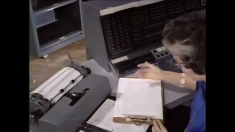 1957 - A logistics support manager works out a problem which the data processing Stock Footage 86136740