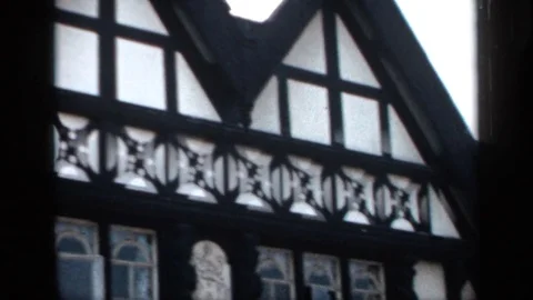 1957: An Outside View of a Building with Many Windows Scanning from Top to Stock Footage 73819982
