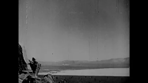 1958 - Albert Einstein and various scientists are shown at work and an atomic Stock Footage 86407890
