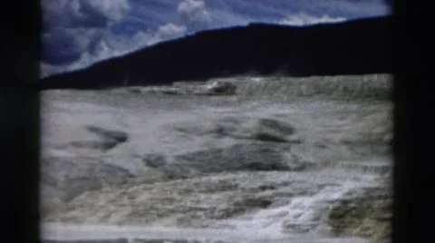 1958: beautiful cascading waterfall on rugged mountain ridge MONTANA Stock Footage