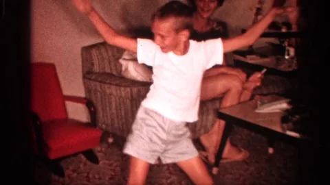 1958: Boy Dancing Joyfully in Backyard, Florida 1958 Stock Footage 73397621