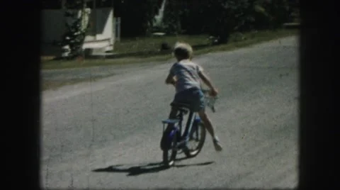 1958: children playing and riding bikes on a friendly competition AMES, IOWA Stock Footage