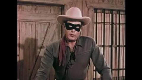 1958 - Dressed as the Lone Ranger, actor Clayton Moore promotes the Peace Patrol Stock Footage 102561829