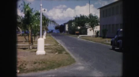 1958: at a harbor town a sea plane takes off in the water flies Stock Footage
