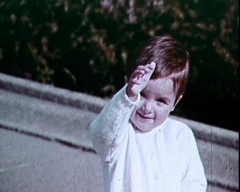 1958: Little Boy Waves to Camera Stock Footage 90994917