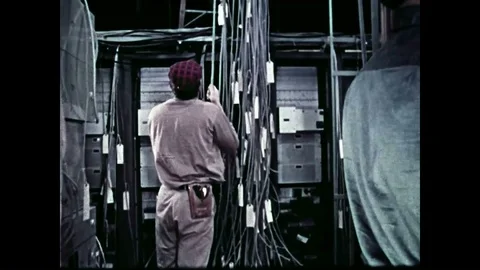 1958  Men install cables and circuits during the construction of the Aleutian Stock Footage 86137685