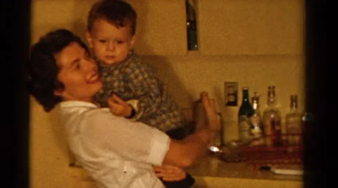 1958: mom talking to her son while holding him close MINNESOTA Stock Footage