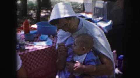 1958: a mother with a small child is seen AMES, IOWA Stock Footage
