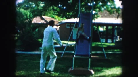 1958: in the park with the kids and family to strengthen ties and feeling. AMES Stock Footage