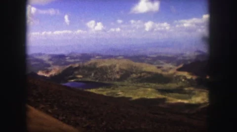1958: riding by rail or road, steep slope overlooking valley, lakes Stock Footage