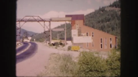 1958: train track leading to ore processing building COLORADO Stock Footage