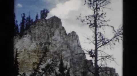 1958: winter mountain view with water fall and trees MONTANA Stock Footage