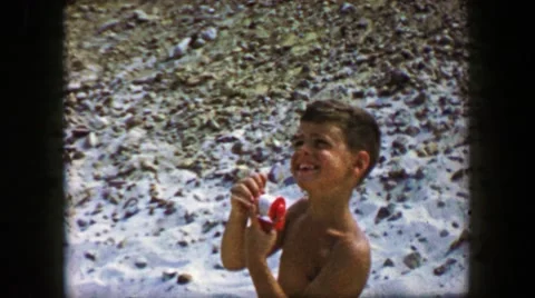 1959: Boy Flying Kite String Reel Controlling Closeup Crank Beach Activity. CAPE 動画素材 66005561