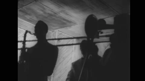 1959 - "Cool jazz" is performed by a small band while a narrator explains the Stock Footage 238545492