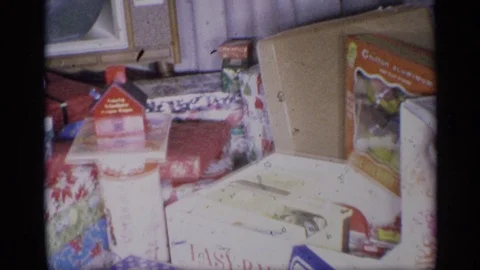 1959: Gifts and Objects Arranged for Christmas Celebration at a New York Home Stock Footage 73401247