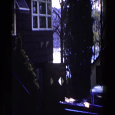 1959: House Plot on the Shore of a Lake with Vehicles Parked in the Yard Vídeos de archivo 69415811
