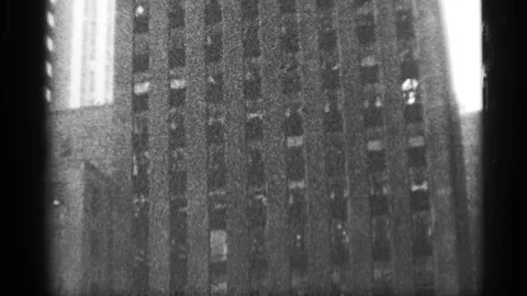 1959: Overview of multi-storied edifice as camera pans up to top of building. 스톡 동영상 73401436