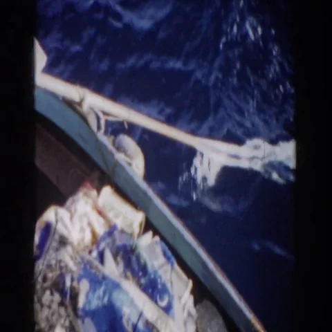 1959: View of an Oar Pulling in the Water from a Boat in Gibraltar Stock Footage 69417941