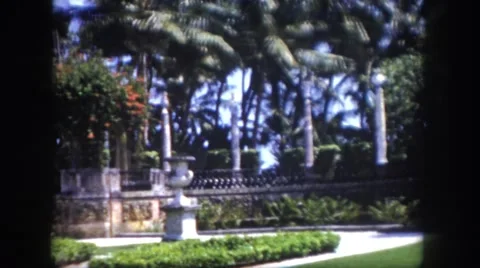 1960: behind the walls of castle is gorgeous white stone house with workers Stock Footage
