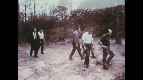 1960 Men meet at a plot to be used as a landfill in the future. Vídeos de archivo 115373281