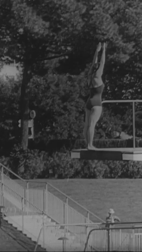 1960 - The Olympic torch is lit for the summer games in Rome, Italy. Diver Stock Footage 284126964