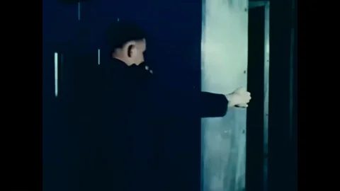 1960 - Technicians are seen at work in the environmental testing chamber at the Stock Footage 95244519