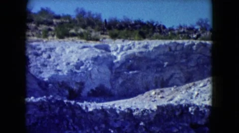 1960: view of mountain mining operation covered with layers of gravel and rocks Stock Footage