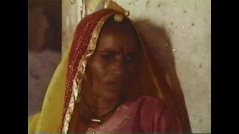 1960 - When a child has a fever in India, her blood is tested for malaria. Stock Footage 155854442