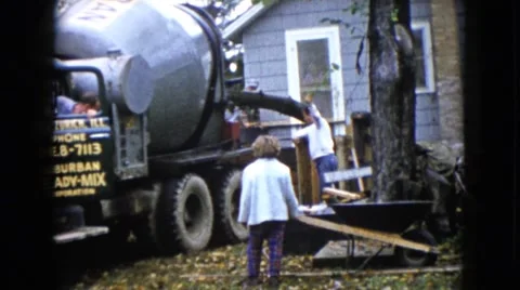 1960: workers stand beside a huge concrete mixing machine WAUCONDA, ILLINOIS Stock Footage