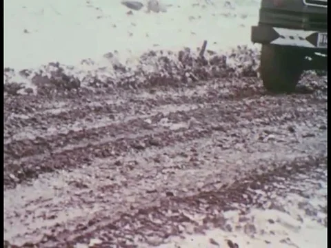 1960s _Trash is compacted at a landfill in a cold weather climate. Stock Footage
